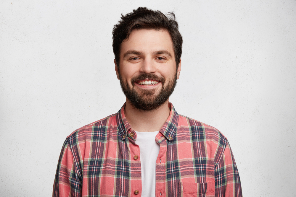 young bearded man with striped shirt